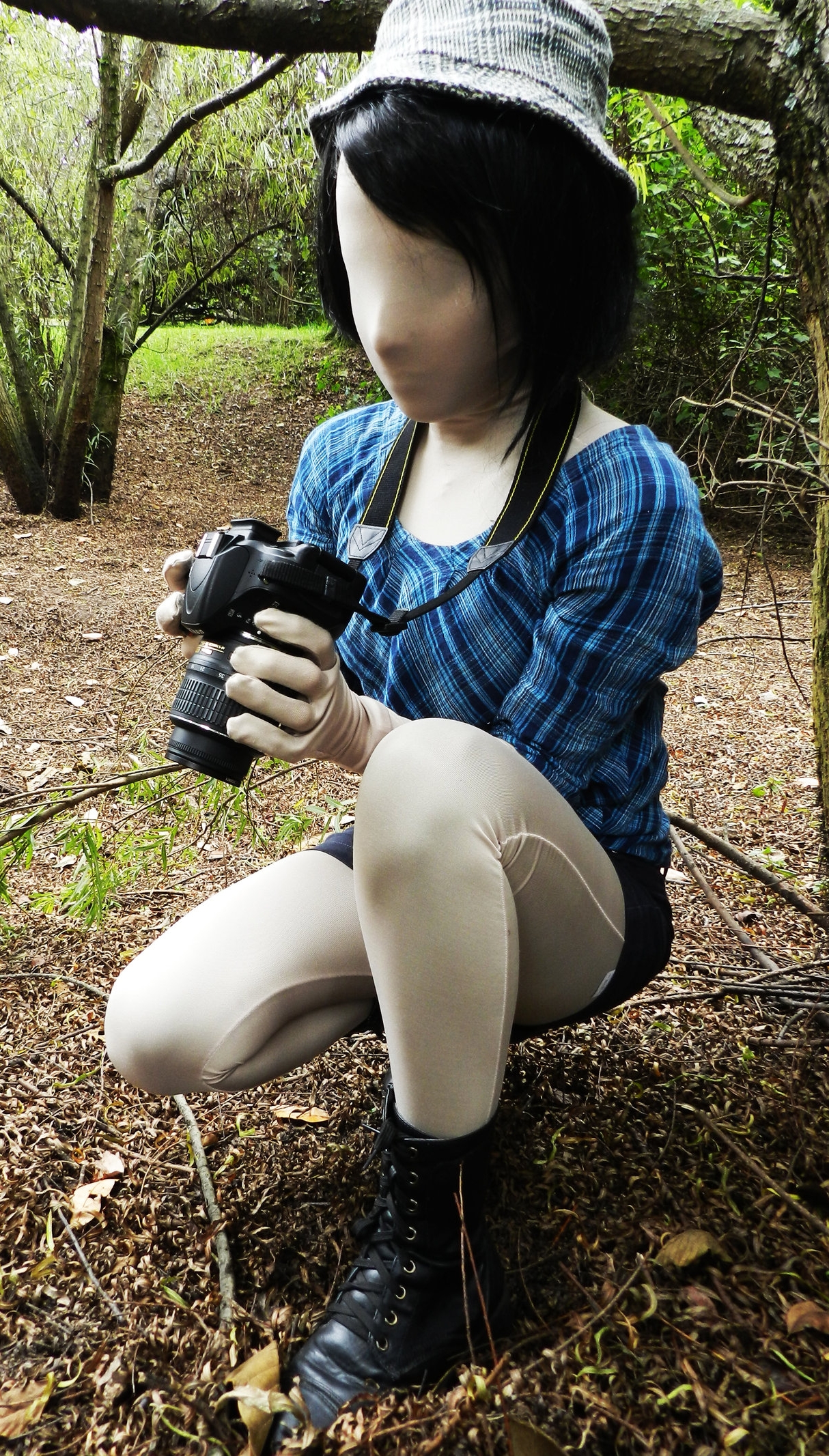 Black-Haired Girl Totally encased in White Opaque Lycra Tights wearing Black Shoes and Miniskirt